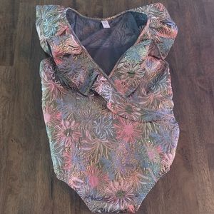 Metalic pink and blue bodysuit with ruffled shoulder detail